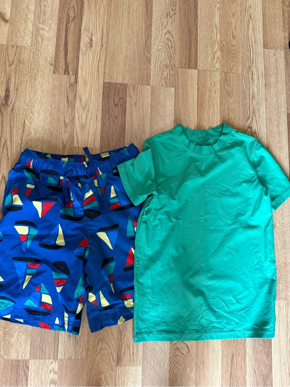Green Rashguard with Blue Sailboat Swim Trunks